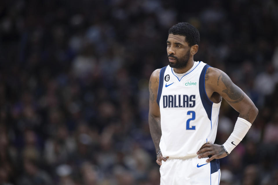 Kyrie Irving is guarded by the Dallas Mavericks