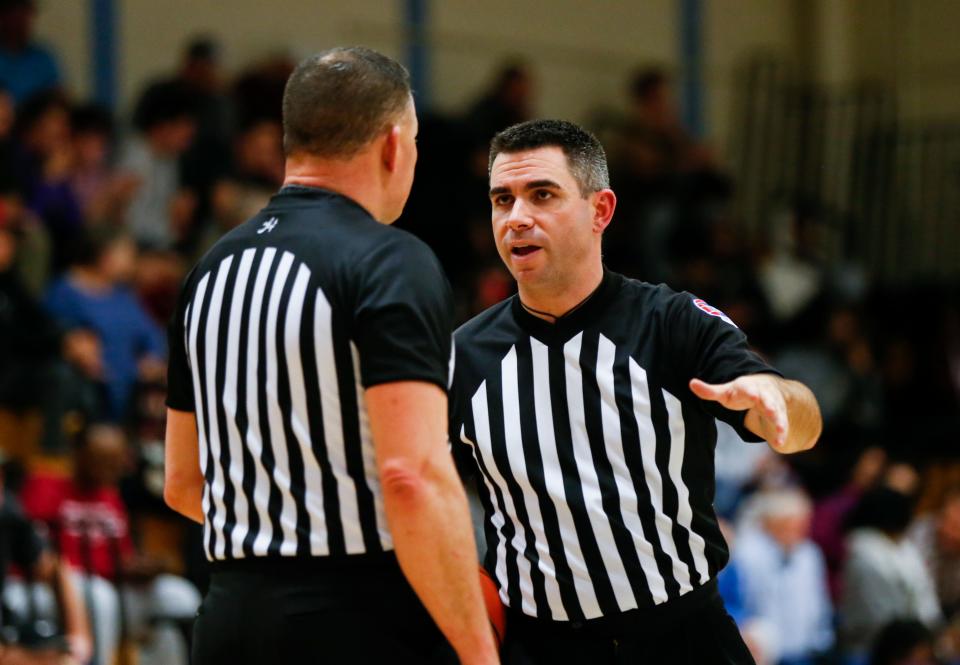 Jordan Hunter officiates a basketball game between the Link Academy Lions and the Legacy (Texas) Broncos at Glendale High School on Thursday, Dec. 8, 2022.