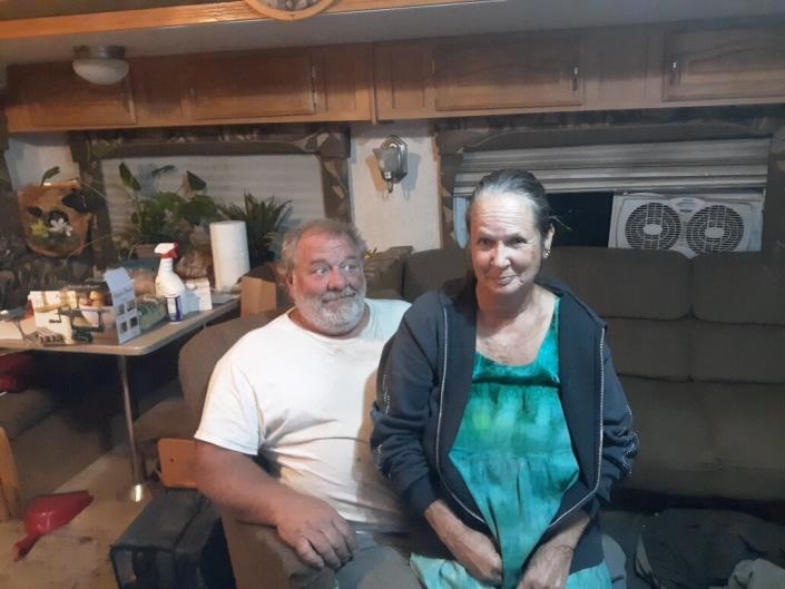 Therese and John Rubiolo sit in a trailer in Concow, California, where they've been living since the Camp fire destroyed their home. (Photo: Courtesy of Therese Rubiolo)