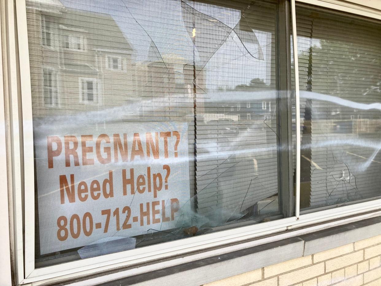 A broken window at Right to Life of Northeast Ohio's Akron office after an unidentified individual threw rocks at the building last Friday.