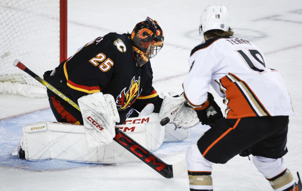 Anaheim Ducks forward Troy Terry (19) has his shot stopped by Calgary Flames goalie Jacob Markstrom (25) during the second period of an NHL hockey game Tuesday, April 2, 2024, in Calgary, Alberta. (Jeff McIntosh/The Canadian Press via AP)