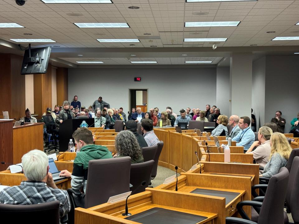 Supporters and opponents pack the Green Bay City Council chambers on Thursday to testify about a nonprofit group's request to build 21 tiny homes of supportive housing with a preference given to veterans.
