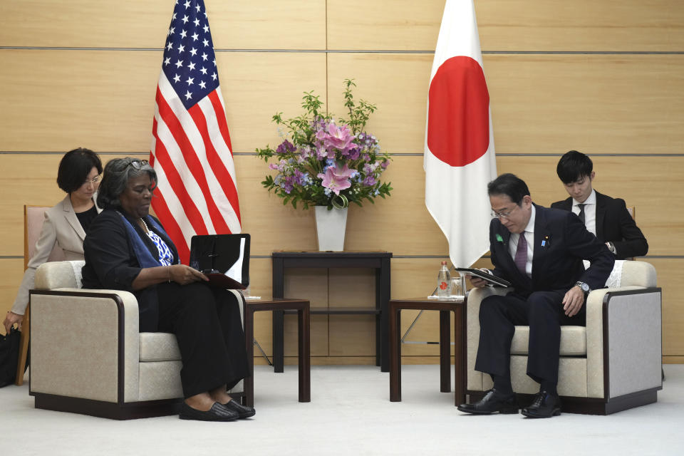 U.S. Ambassador to United Nations Linda Thomas-Greenfield, left, and Japan's Prime Minister Fumio Kishida, right, prepare to talk during a meeting Friday, April 19, 2024, at prime minister's office in Tokyo. (AP Photo/Eugene Hoshiko, Pool)