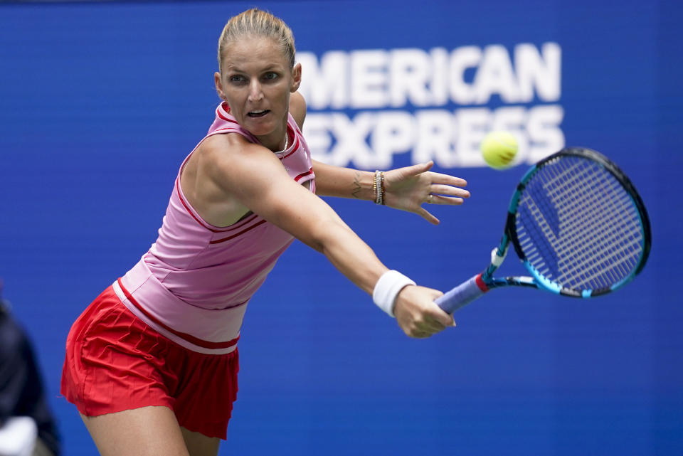 Karolina Pliskova, of the Czech Republic, returns a shot to Aryna Sabalenka, of Belarus, during the quarterfinals of the U.S. Open tennis championships, Wednesday, Sept. 7, 2022, in New York. (AP Photo/Seth Wenig)