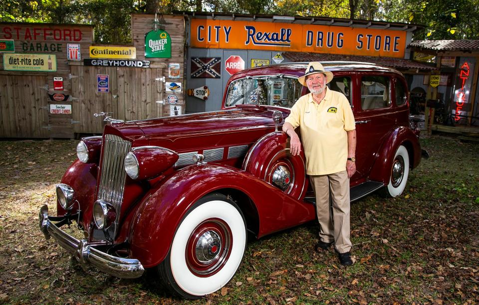 Frank Stafford stands next to his 1937 Packard outside his home in Ocala on Dec. 31, 2020.