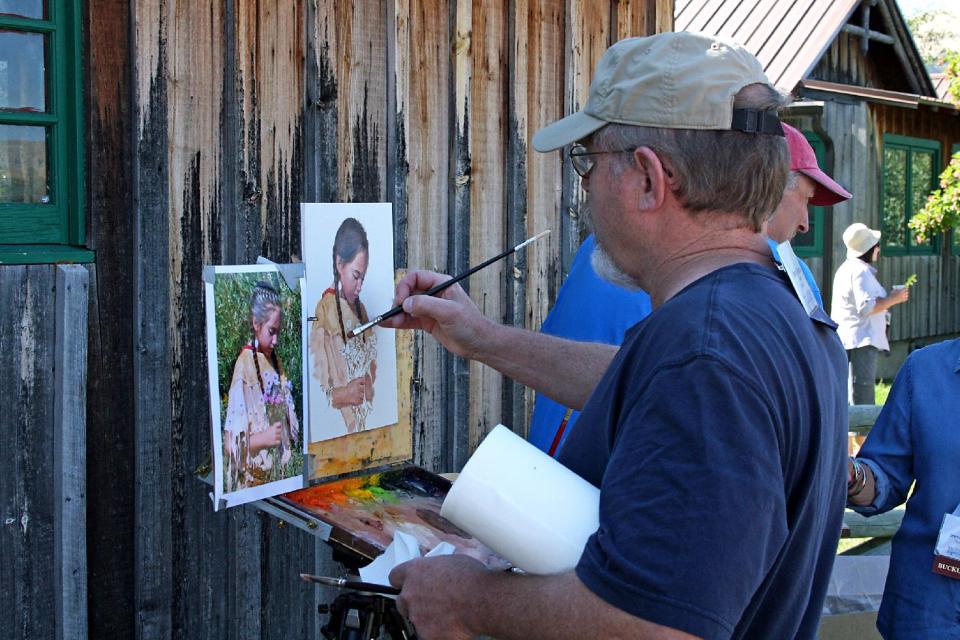 This Aug. 20, 2011 photo shows artist Barry Eisenach of Arvada, Colo., participating in Quick Draw at the Sieben Ranch north of Helena, Mont.. Quick Draw, an event in which artists create works outdoors in public in a matter of hours, is part of an annual August art festival called the Western Rendezvous of Art centered in Helena. (AP Photo/Ron Zellar)