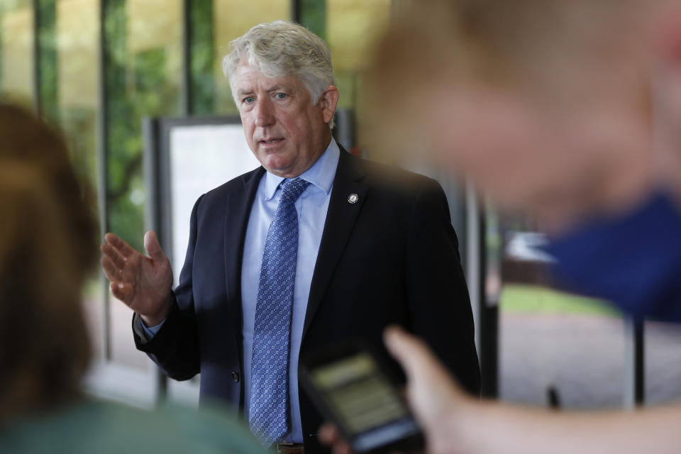 Virginia Attorney General Mark Herring gestures as he speaks with reporters ouside Richmond General District Court Thursday June 18, 2020, in Richmond, Va. Herring responded to questions concerning a judges extension of an injunction preventing the removal of the statue of Confederate General Robert E. Lee on Monument ave. (AP Photo/Steve Helber)