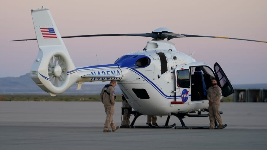 A NASA helicopter waits for the arrival of a space capsule carrying NASA’s first asteroid samples on Sunday, Sept. 24, 2023, to a temporary clean room at Dugway Proving Ground, in Utah. The Osiris-Rex spacecraft released the capsule following a seven-year journey to asteroid Bennu and back. (AP Photo/Rick Bowmer)