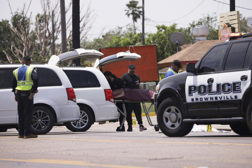 Emergency personnel respond to a fatal collision in Brownsville, Texas, on Sunday, May 7, 2023. Several migrants were killed after they were struck by a vehicle while waiting at a bus stop near Ozanam Center, a migrant and homeless shelter. (AP Photo/Michael Gonzalez)