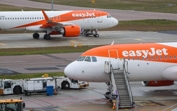 News Shopper: Two easyJet planes at an airport (PA)