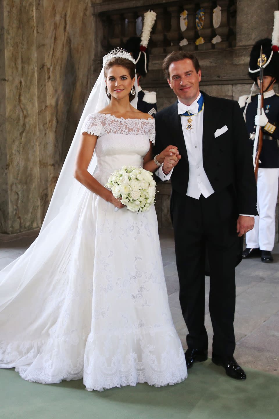 <p>The Princess and her new husband, Christopher O'Neill, beamed on their wedding day. Madeleine wore a gorgeous Valentino gown paired with the <a href="https://www.thecourtjeweller.com/2019/07/princess-madeleines-modern-fringe-tiara.html" rel="nofollow noopener" target="_blank" data-ylk="slk:Modern Fringe Tiara;elm:context_link;itc:0;sec:content-canvas" class="link ">Modern Fringe Tiara</a> for the special occasion. </p>