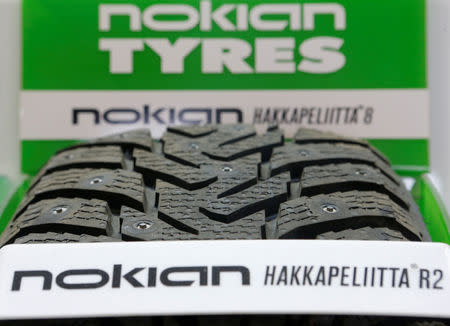 FILE PHOTO: A Nokian tyre is on display at a tyre assembling centre and shop in Moscow, August 8, 2014.REUTERS/Maxim Shemetov/File Photo