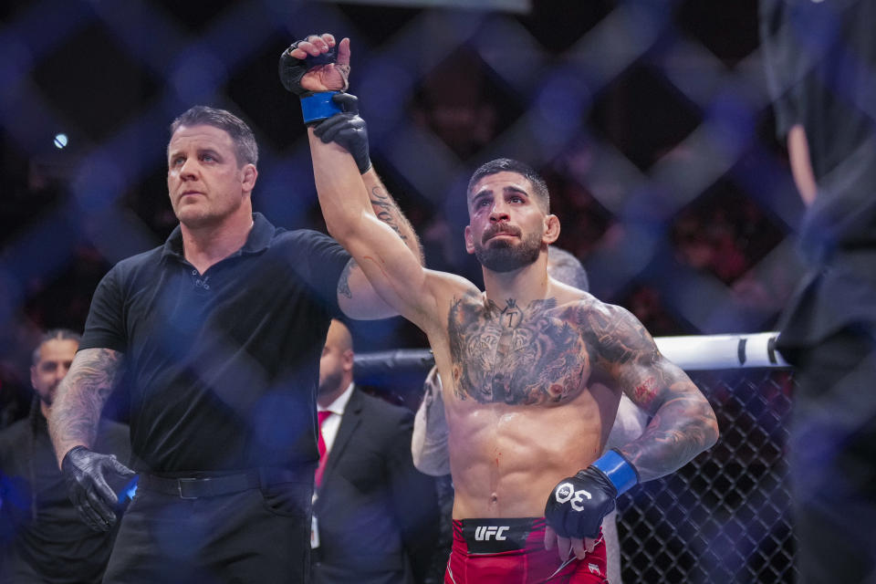 Jun 24, 2023; Jacksonville, Florida, USA; Ilia Topuria (blue gloves) wins a unanimous decision against Josh Emmett (red gloves) in a featherweight bout during UFC Fight Night at VyStar Veterans Memorial Arena. Mandatory Credit: David Yeazell-USA TODAY Sports