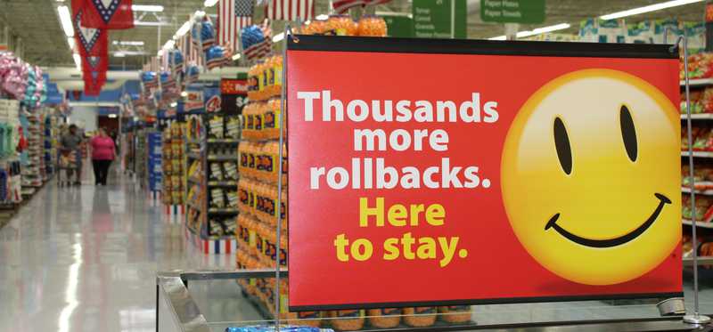 An aisle at Walmart with promotional signage.