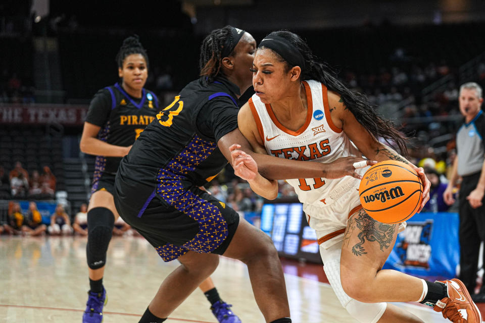 Texas guard Sonya Morris pushes past East Carolina forward Amiya Joyner during Saturday night's game. The Longhorns won't have much rest before facing Louisville in the second round Monday night. "I think the evaluation now comes: how does she feel tomorrow?" UT coach Vic Schaefer said.