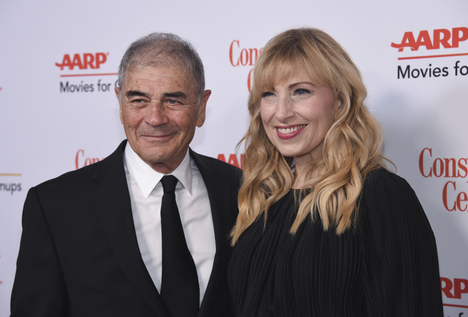 FILE - In this Jan. 4, 2019 file photo, Robert Forster, left, and Denise Grayson attend the 18th Annual Movies For Grownups Awards at Beverly Wilshire Hotel, in Beverly Hills, Calif. Forster, the handsome character actor who got a career resurgence and Oscar-nomination for playing bail bondsman Max Cherry in "Jackie Brown," has died at age 78. Forster's agent Julia Buchwald says he died Friday, Oct. 11, 2019, at home in Los Angeles of brain cancer. (Photo by Phil McCarten/Invision/AP, File)