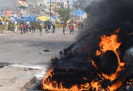 A vehicle vandalised during a clash between anti CAA and pro CAA demonstrations, at Bhajanpura on February 24, 2020 in New Delhi, India. A Delhi Police cop and three civilians have died, a DCP-rank officer injured, a petrol pump torched, a number of houses, cars and shops burnt after clashes between pro and anti-CAA protesters in Maujpur and Jafarabad areas of North East Delhi. There was tension in the area after hundreds of anti-CAA protesters, mostly women, blocked a road near the Jaffrabad metro station connecting Seelampur with Maujpur and Yamuna Vihar. (Photo by Sanchit Khanna/Hindustan Times)