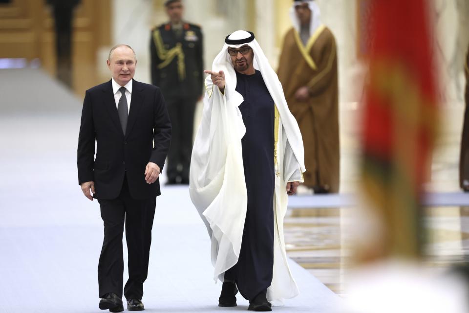 Emirati President Sheikh Mohammed bin Zayed Al Nahyan, right, and Russian President Vladimir Putin attend an official welcome ceremony at Qasr Al Watan, Abu Dhabi, United Arab Emirates, Wednesday, Dec. 6, 2023. (Sergei Savostyanov, Sputnik, Kremlin Pool Photo via AP)