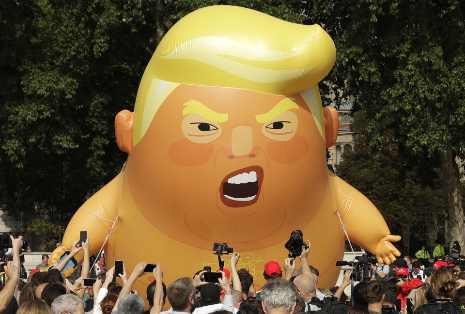 President Donald Trump is flown as a protest on 13 July 2018 against his visit, in Parliament Square in London. Source: AP