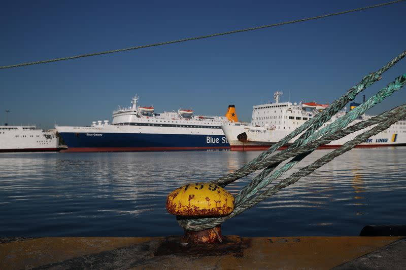 Passenger ships are moored during a 24-hour strike at the Port of Piraeus, near Athens