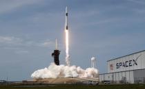 A SpaceX Falcon 9 rocket and Crew Dragon spacecraft carrying NASA astronauts Douglas Hurley and Robert Behnken lifts off