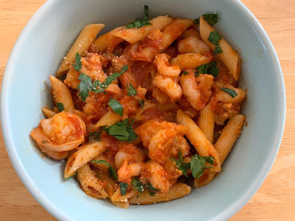 The finished pasta and shrimp in a bowl