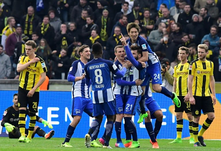 Hertha Berlin's Marvin Plattenhardt celebrates with teammates after scoring their second goal against Borussia Dortmund in Berlin, Germany, on March 11, 2017