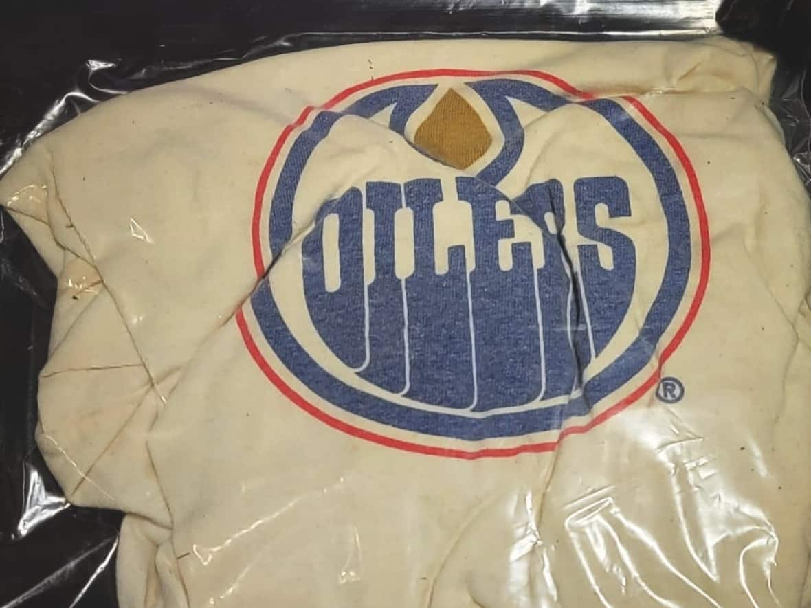 The Edmonton Oilers T-shirt belonged to Colin Wilmot, Matthew Heneghan's best friend and one of the 158 Canadian Armed Forces members who died in service in Afghanistan from 2002 to 2011. (Submitted by Matthew Heneghan - image credit)