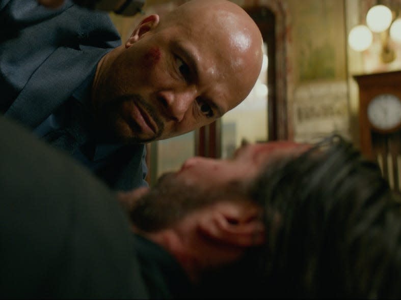 Common as Cassian and Keanu Reeves as John Wick in the Rome Continental.