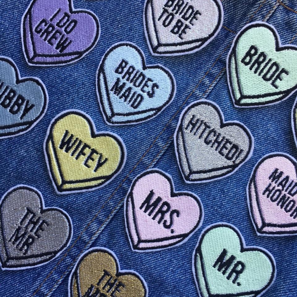 Patch things up (in a good way) with these heart-shaped patches that say sweet nothings like "I Do Crew" and "Bride Tribe."&nbsp;<strong><a href="https://fave.co/35tEFol" target="_blank" rel="noopener noreferrer">Get the patch at Etsy</a></strong>.<a href="https://fave.co/35tEFol" target="_blank" rel="noopener noreferrer">﻿</a> (Photo: Etsy / EllisandEliza)