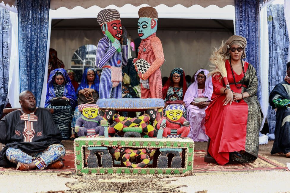 Members of the royal family and a guardian of the throne surround the throne of Mouhammad-Nabil Mfonrifoum Mbombo Njoya (unseen), Sultan King of the Bamouns, ahead of the inauguration ceremony of the new Bamoun Kings Museum in Foumban.