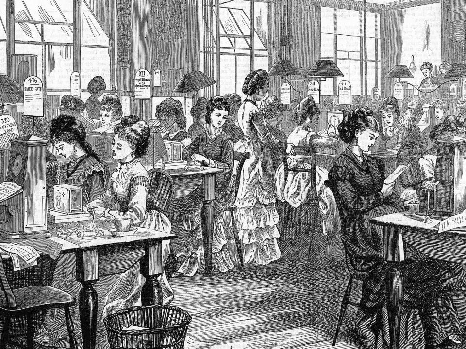 An illustration of several women working at telegraph machines at the Post Office Telegraph Headquarters in London in 1871