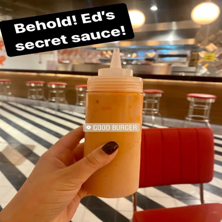 hand holding bottle of Ed's Secret Sauce