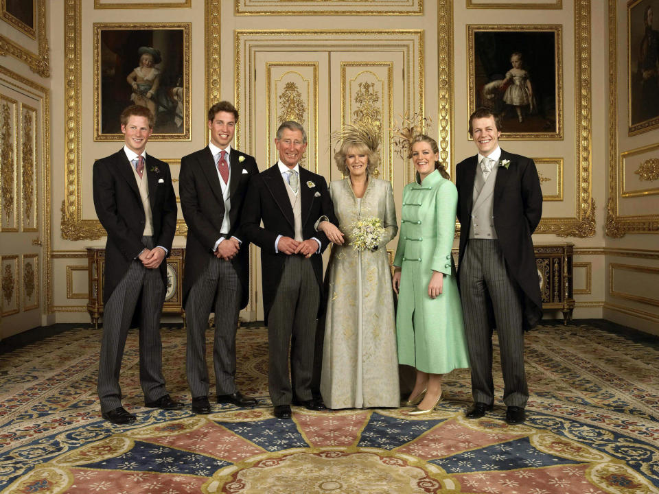 Britain's Prince of Wales and his wife Camilla, Charles' sons, Prince Harry, (far left) and Prince William (2nd L), Camilla's children Laura (2nd R) and Tom Parker Bowles, (far right) gathered around Charles and Camilla in the White Drawing Room at Windsor Castle. 