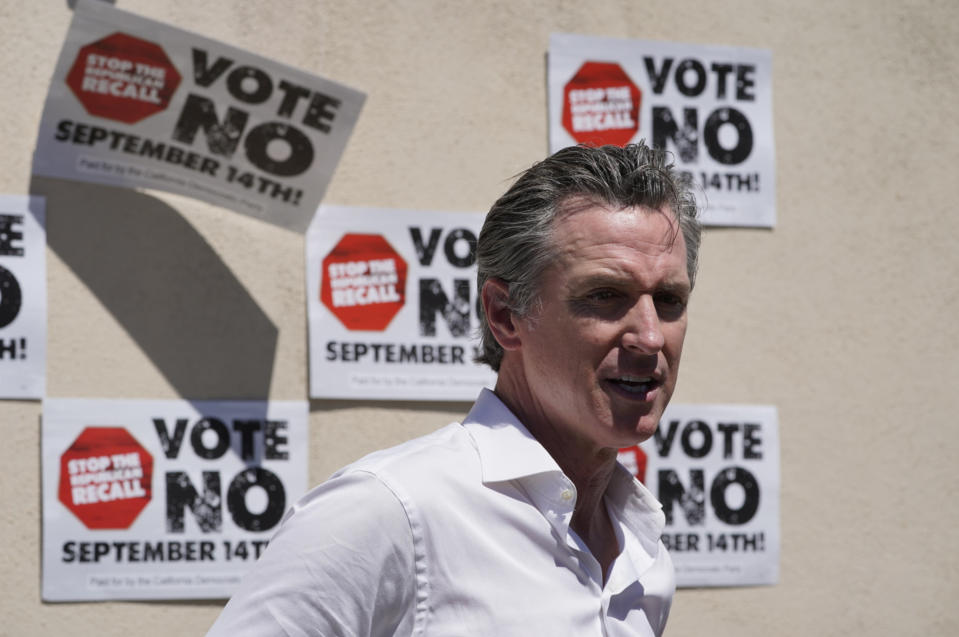 California Gov. Gavin Newsom takes questions from the media after a campaign event against the California recall election at Culver City High School in Culver City, Calif., Saturday, Sept. 4, 2021. (AP Photo/Damian Dovarganes)