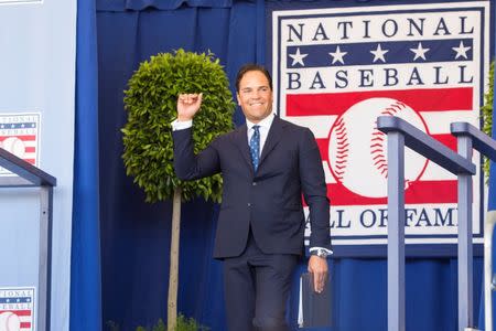 Jul 24, 2016; Cooperstown, NY, USA; Hall of Fame Inductee Mike Piazza waves after being introduced during the 2016 MLB baseball hall of fame induction ceremony at Clark Sports Center. Mandatory Credit: Gregory J. Fisher-USA TODAY Sports
