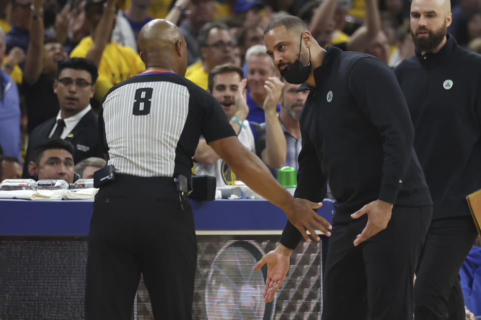 Boston Celtics head coach Ime Udoka, right, gestures toward referee Marc Davis during the first half of his team's Game 5 of basketball's NBA Finals against the Golden State Warriors in San Francisco, Monday, June 13, 2022. (AP Photo/Jed Jacobsohn)