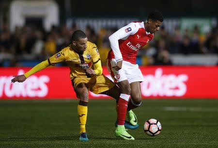 Britain Football Soccer - Sutton United v Arsenal - FA Cup Fifth Round - The Borough Sports Ground - 20/2/17 Arsenal's Jeff Reine-Adelaide in action with Sutton United's Craig Eastmond Action Images via Reuters / Andrew Couldridge Livepic