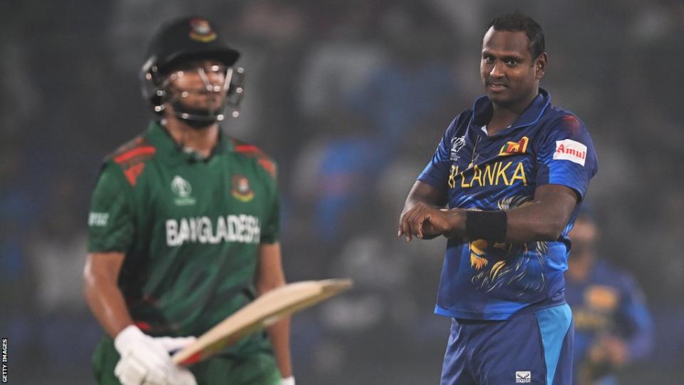 Angelo Mathews taps his wrist after dismissing Shakib Al Hasan in Cricket World Cup match between Sri Lanka and Bangladesh
