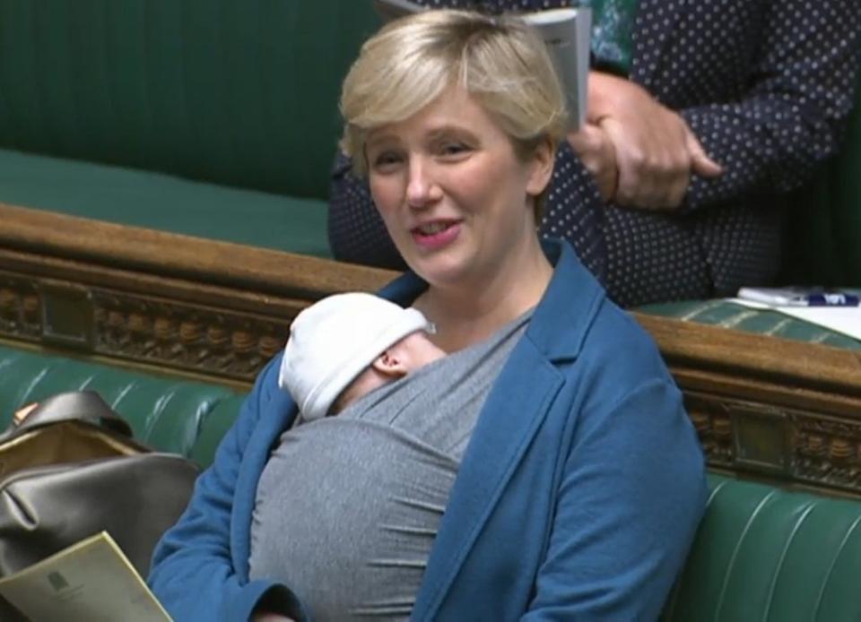 Labour MP Stella Creasy speaking in the chamber of the House of Commons with her newborn baby strapped to her (House of Commons/PA) (PA Wire)