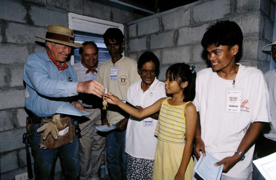 President Carter (left) in Maragondon, Philippines, in 1999.