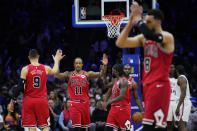 Chicago Bulls' DeMar DeRozan (11) celebrates with his teammates after a foul call during double overtime in an NBA basketball game against the Philadelphia 76ers, Monday, March 20, 2023, in Philadelphia. (AP Photo/Matt Slocum)