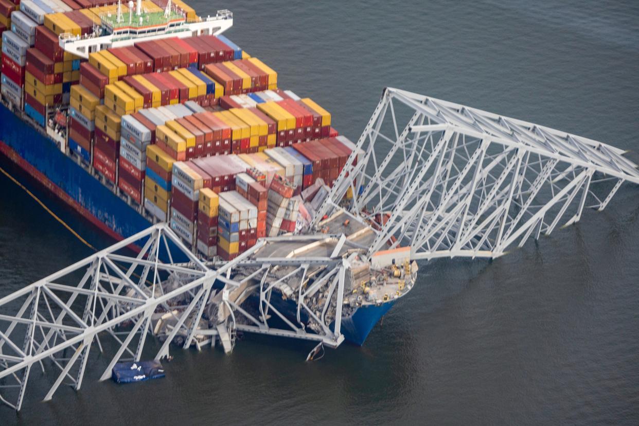 In an aerial view, cargo ship Dali is seen after running into and collapsing the Francis Scott Key Bridge on March 26, 2024 in Baltimore.