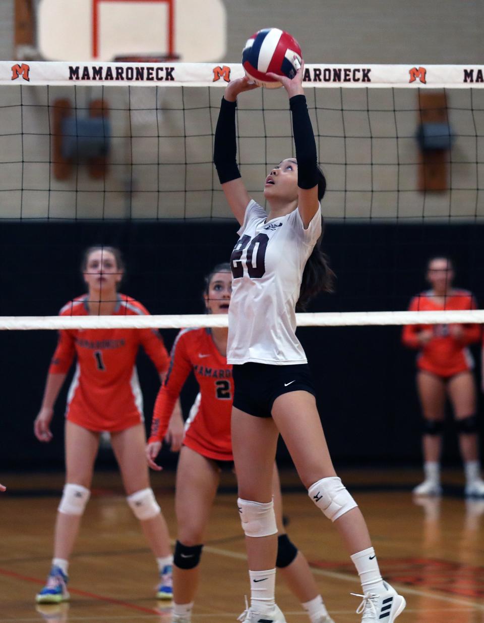 Scarsdale's Karina Cheng sets the ball during a match against Mamaroneck.