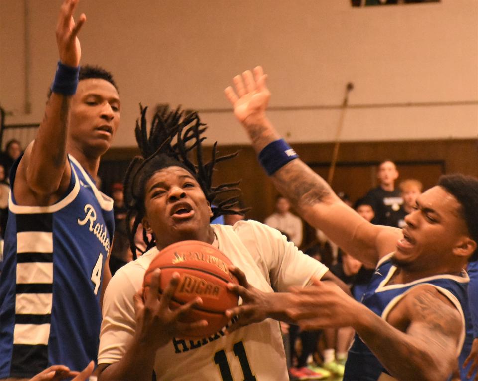 Herkimer College General Jayson McGhee drives between Fulton-Montgomery Community College defenders during the Region III championship game. Both teams will be among 12 competing in this week's national turnament in Herkimer.