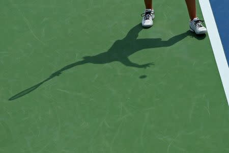 Aug 19, 2017; Mason, OH, USA; A view of the shadow of Karolina Pliskova (CZE) as she serves against Garbine Muguruza (ESP) during the Western and Southern Open at the Lindner Family Tennis Center. Mandatory Credit: Aaron Doster-USA TODAY Sports