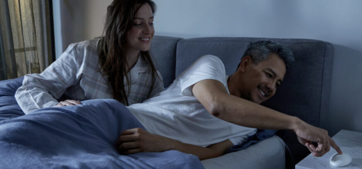 man and woman in bed