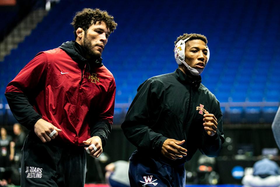 Iowa State's Yonger Bastida, left, and David Carr warm up during the practice session of the NCAA Division I Wrestling Championships, Wednesday, March 15, 2023, at BOK Center in Tulsa, Okla.
