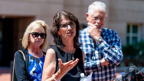 PHOTO: Diane Foley, the mother of James Foley, center, accompanied by Carl and Marsha Mueller, the parents of Kayla Mueller, speaks after the sentencing of El Shafee Elsheikh at the  District Courthouse in Alexandria, Va., Aug. 19, 2022. (Andrew Harnik/AP)