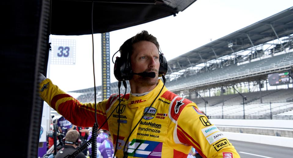 Andretti Autosport driver Romain Grosjean (28) of France looks out from his pit box Thursday, May 19, 2022, during the third day of Indianapolis 500 practice at Indianapolis Motor Speedway. 